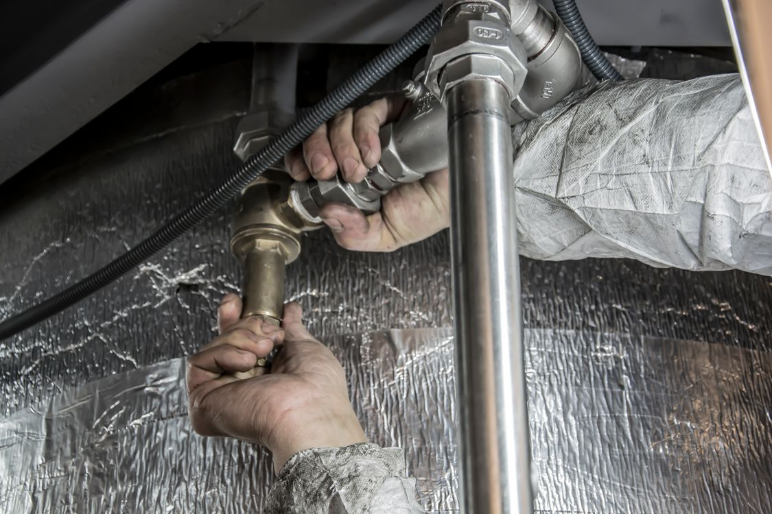 Green Pipe Plumbing master plumber working on pipes in Kerrville, Texas